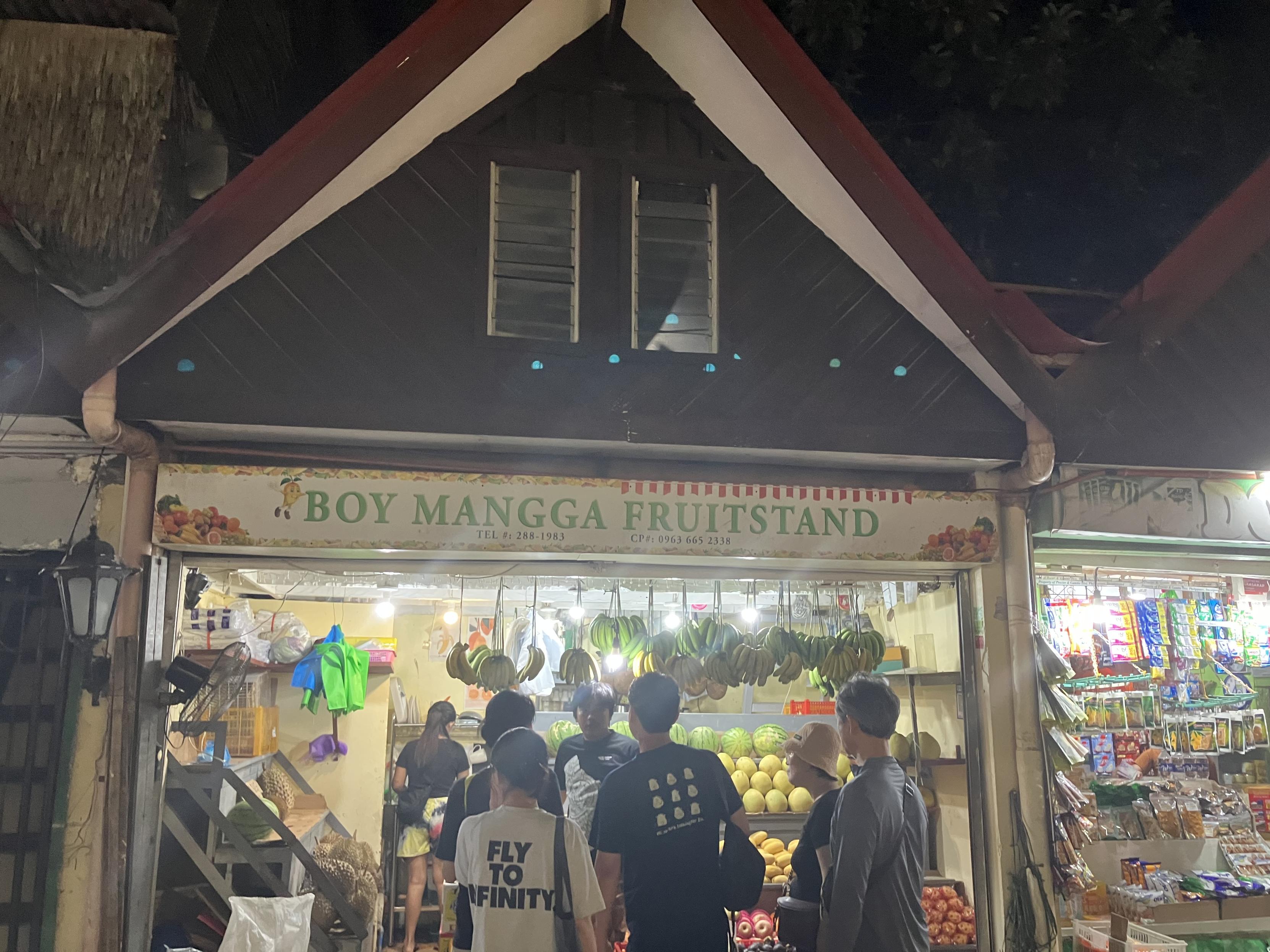 The marquee of a storefront called Boy Mangga Fruitstand